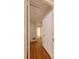 Hallway with hardwood floors, neutral paint and access to rooms at 2685 Buena Vista Ave, Doraville, GA 30340