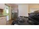 Galley-style kitchen featuring stainless steel refrigerator and black range at 2685 Buena Vista Ave, Doraville, GA 30340