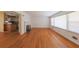 Open-concept living room with hardwood floors, fireplace, and view of the kitchen at 2685 Buena Vista Ave, Doraville, GA 30340