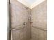 Shower with grab bars and tiled surround at 2685 Buena Vista Ave, Doraville, GA 30340