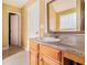 Bathroom featuring vanity with granite countertop, and glass block window at 3243 Timber Rdg, College Park, GA 30349
