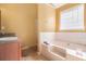 Bathroom features a bathtub and separate shower at 3243 Timber Rdg, College Park, GA 30349