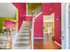 Inviting entryway with staircase, colorful walls, and hardwood floors at 3243 Timber Rdg, College Park, GA 30349