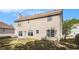 View of the rear of a beige two story home with well kept back yard at 3243 Timber Rdg, College Park, GA 30349