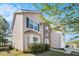 View of two story home with beige siding and stone entryway at 3243 Timber Rdg, College Park, GA 30349