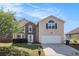 Well maintained two story home featuring stone accents and a pristine lawn at 3243 Timber Rdg, College Park, GA 30349