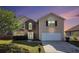 Charming two-story home with a well-manicured lawn and a two car garage at 3243 Timber Rdg, College Park, GA 30349