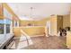 Bright living room with tile floors, yellow walls and an open layout at 3243 Timber Rdg, College Park, GA 30349