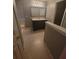 Upstairs bathroom offering a single vanity, great lighting and storage at 3371 Metro Way, Snellville, GA 30039