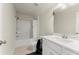 Bathroom featuring a shower-tub combo, toilet, mirror, and vanity with modern fixtures at 350 Hayden Cir, Woodstock, GA 30189