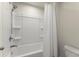 Clean and functional bathroom featuring a shower-tub combination with a white shower curtain at 350 Hayden Cir, Woodstock, GA 30189