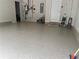 Spacious garage featuring an epoxy floor, laundry area, utilities, and ample storage, ideal for projects at 350 Hayden Cir, Woodstock, GA 30189