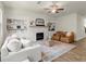 Cozy living room with fireplace, built-in shelving and hardwood flooring at 350 Hayden Cir, Woodstock, GA 30189