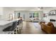 Open-concept living space with an island breakfast bar and fireplace at 350 Hayden Cir, Woodstock, GA 30189
