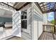 Bedroom view through French doors to covered patio with wooden pergola and outdoor lighting at 350 Hayden Cir, Woodstock, GA 30189