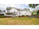 Spacious backyard featuring a deck, patio, manicured lawn and established landscaping at 914 Denmeade Sw Walk, Marietta, GA 30064