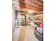 Unfinished basement with exposed ceiling and walls, featuring a mix of storage and potential at 914 Denmeade Sw Walk, Marietta, GA 30064