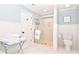 This well-lit bathroom is beautifully appointed with a walk-in shower and coordinated white tile floor at 914 Denmeade Sw Walk, Marietta, GA 30064