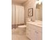 Neutral bathroom featuring a shower with a gingham curtain, a toilet, and a white vanity at 914 Denmeade Sw Walk, Marietta, GA 30064