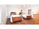 A quaint bedroom featuring two beds, adorned with teddy bears, offers a comforting space for rest and relaxation at 914 Denmeade Sw Walk, Marietta, GA 30064