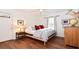 This bright bedroom features wood flooring, a stuffed animal, and art to complete the space at 914 Denmeade Sw Walk, Marietta, GA 30064