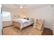 This cozy bedroom features natural lighting and a comfy floral armchair to make the space more inviting at 914 Denmeade Sw Walk, Marietta, GA 30064