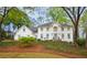 Beautiful two-story home with white brick and lush green landscaping at 914 Denmeade Sw Walk, Marietta, GA 30064