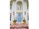 Inviting front entrance with a light blue door, brick steps and decorative planters at 914 Denmeade Sw Walk, Marietta, GA 30064
