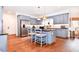 Well-equipped kitchen with stainless steel appliances, granite countertops, and blue cabinets at 914 Denmeade Sw Walk, Marietta, GA 30064