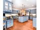 Spacious kitchen with stainless steel appliances, granite countertops and blue cabinetry at 914 Denmeade Sw Walk, Marietta, GA 30064