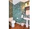 Charming powder room with beautiful wallpaper and pedestal sink at 914 Denmeade Sw Walk, Marietta, GA 30064