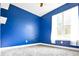 Bedroom featuring plush carpeting, a ceiling fan, and a blue accent wall that provides a relaxing atmosphere at 191 Fairview Oak Trl, Dallas, GA 30157