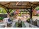 Relax in this backyard's pavilion with stylish outdoor seating and landscaping at 2631 Moon Chase Lane, Buford, GA 30519