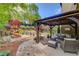 This home features a pavilion, stone patio, and lush, landscaped backyard at 2631 Moon Chase Lane, Buford, GA 30519