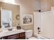 Standard bathroom shows the vanity, toilet and shower-tub combo with curtain at 2631 Moon Chase Lane, Buford, GA 30519