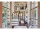 Elegant foyer with hardwood floors, staircase, soaring ceilings, and view to upper level at 2631 Moon Chase Lane, Buford, GA 30519