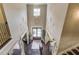 Inviting foyer with soaring ceilings, a stylish chandelier, and elegant double doors creating a grand entrance at 2631 Moon Chase Lane, Buford, GA 30519