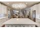Open concept kitchen with a large island and seamless flow to living areas at 2631 Moon Chase Lane, Buford, GA 30519
