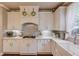 Well-appointed kitchen with white cabinetry, modern appliances, and ample counter space at 2631 Moon Chase Lane, Buford, GA 30519