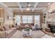 Inviting living room with coffered ceilings, hardwood floors, fireplace, and open layout at 2631 Moon Chase Lane, Buford, GA 30519