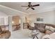 Cozy living room featuring a comfortable sofa, glass coffee table, and open view to the upstairs landing at 2631 Moon Chase Lane, Buford, GA 30519
