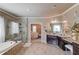 Well-lit main bathroom with a soaking tub, walk-in shower, and spacious vanity with dual sinks, providing ample space at 2631 Moon Chase Lane, Buford, GA 30519