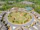 Aerial view of neighborhood amenities including pool, clubhouse, tennis courts, and green spaces at 2890 Canter Meadow Dr, Cumming, GA 30040