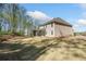 Expansive backyard featuring a well-maintained lawn and lush trees at 2890 Canter Meadow Dr, Cumming, GA 30040