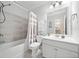 Clean bathroom featuring shower-tub combo, shower curtain, and a vanity with bright mirrors at 2890 Canter Meadow Dr, Cumming, GA 30040