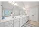 Elegant bathroom with double vanities, quartz counters, and ample storage at 2890 Canter Meadow Dr, Cumming, GA 30040