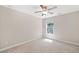 Cozy bedroom featuring neutral walls, plush carpet, ceiling fan, and great natural light at 2890 Canter Meadow Dr, Cumming, GA 30040