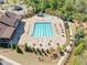 Aerial view highlighting the community pool with water slide, clubhouse, and playground at 2890 Canter Meadow Dr, Cumming, GA 30040