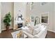 Living room featuring a fireplace, large windows, and neutral decor at 2890 Canter Meadow Dr, Cumming, GA 30040