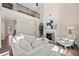 Open living room with a cozy fireplace and ample natural light at 2890 Canter Meadow Dr, Cumming, GA 30040